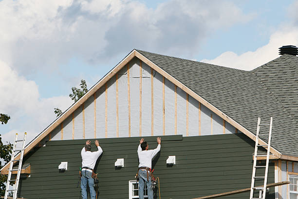 Professional Siding Contractor technician working in Newton, MA